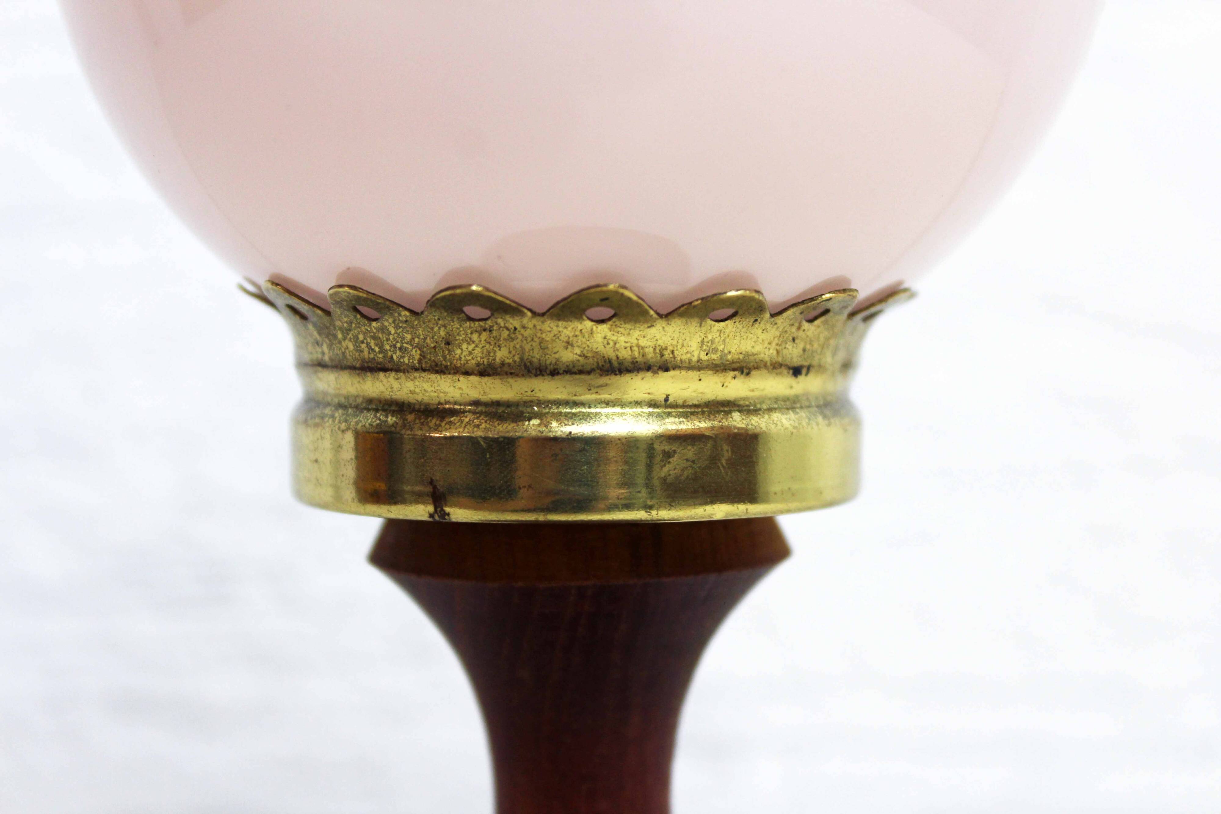 Turned wood and pink glass lamp