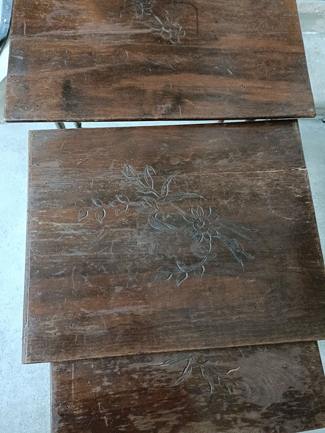 Stackable tables with pyrography.