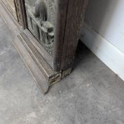 Renaissance-style mirror in wood and copper with a craftsmanship theme.