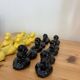 Box of 12 dog-shaped cutlery rests in yellow and black majolica.