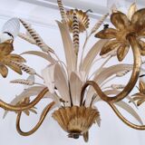 Vintage wrought iron chandelier decorated with golden and beige reeds