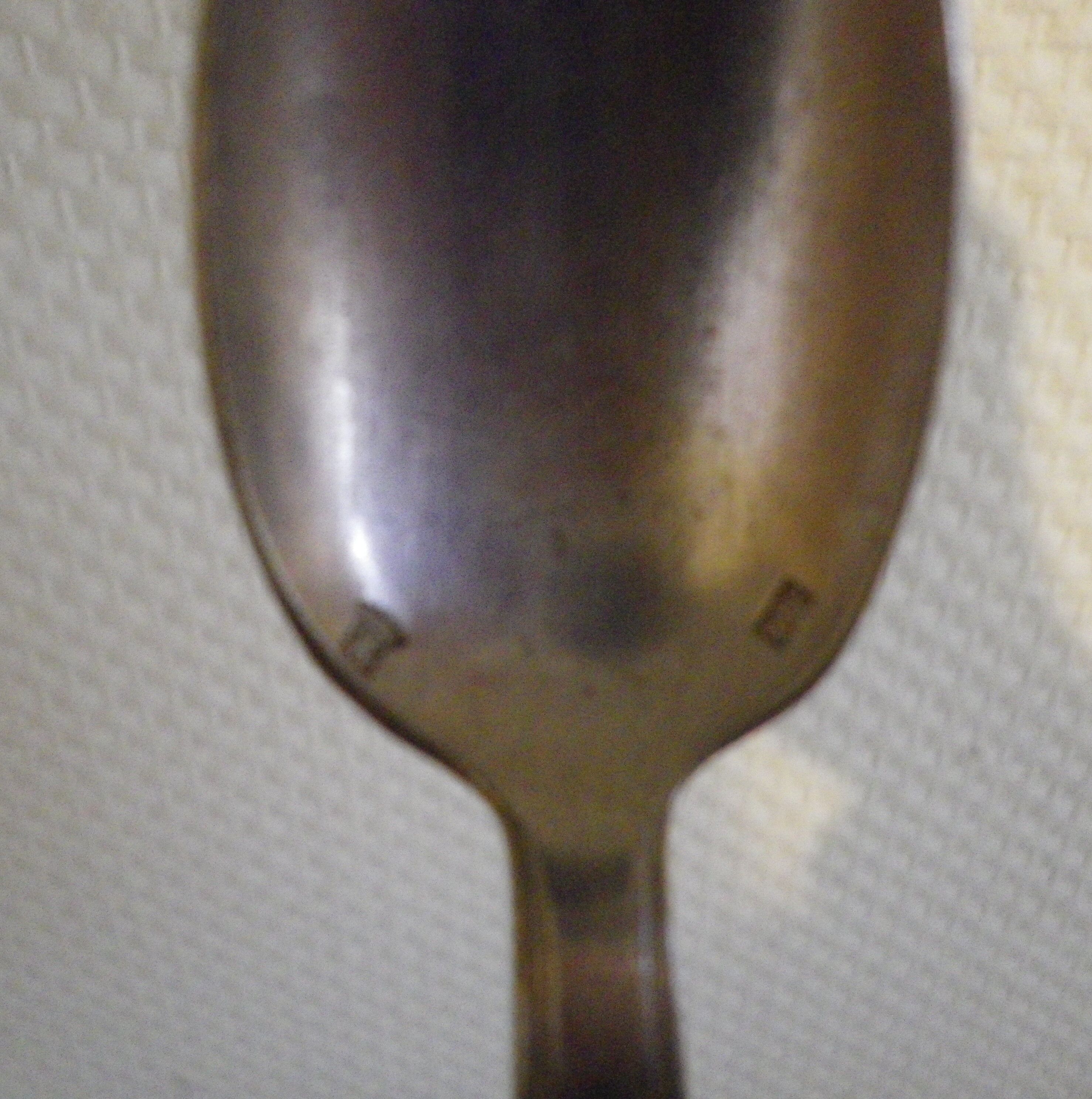 11 silver spoons with punches