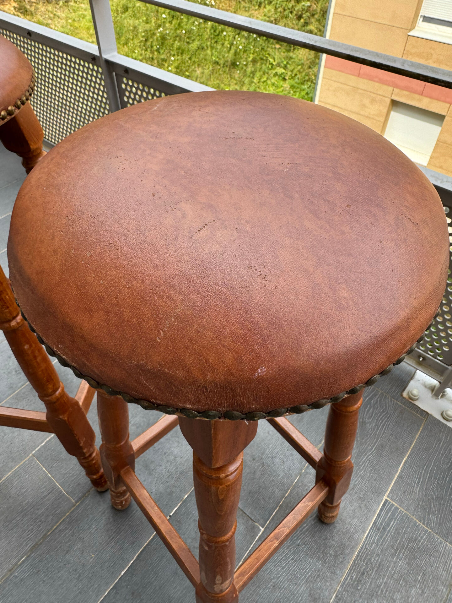 pair of vintage wooden and leather bar stools