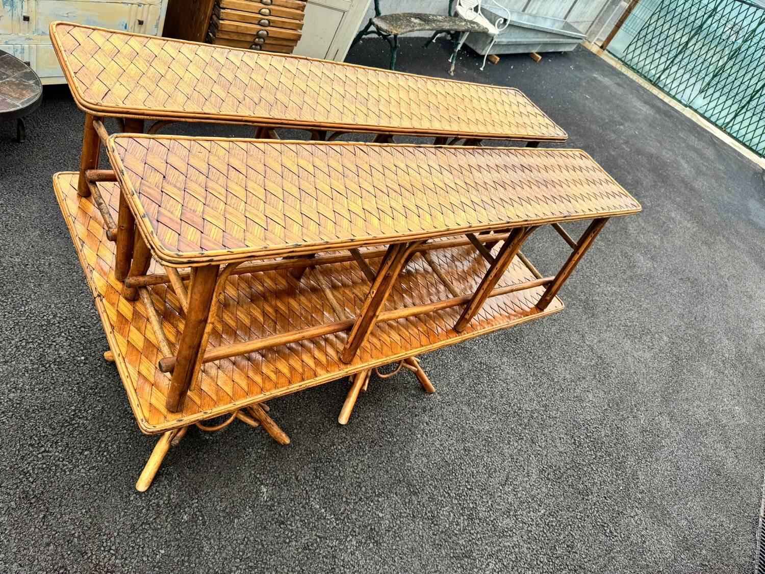 Vintage 1950s set: large table with tripod base and benches in woven chestnut
