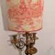 Pair of lamps in gilded brass, red toile de Jouy shades.