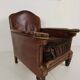 Antique leather club chair with stud detailing