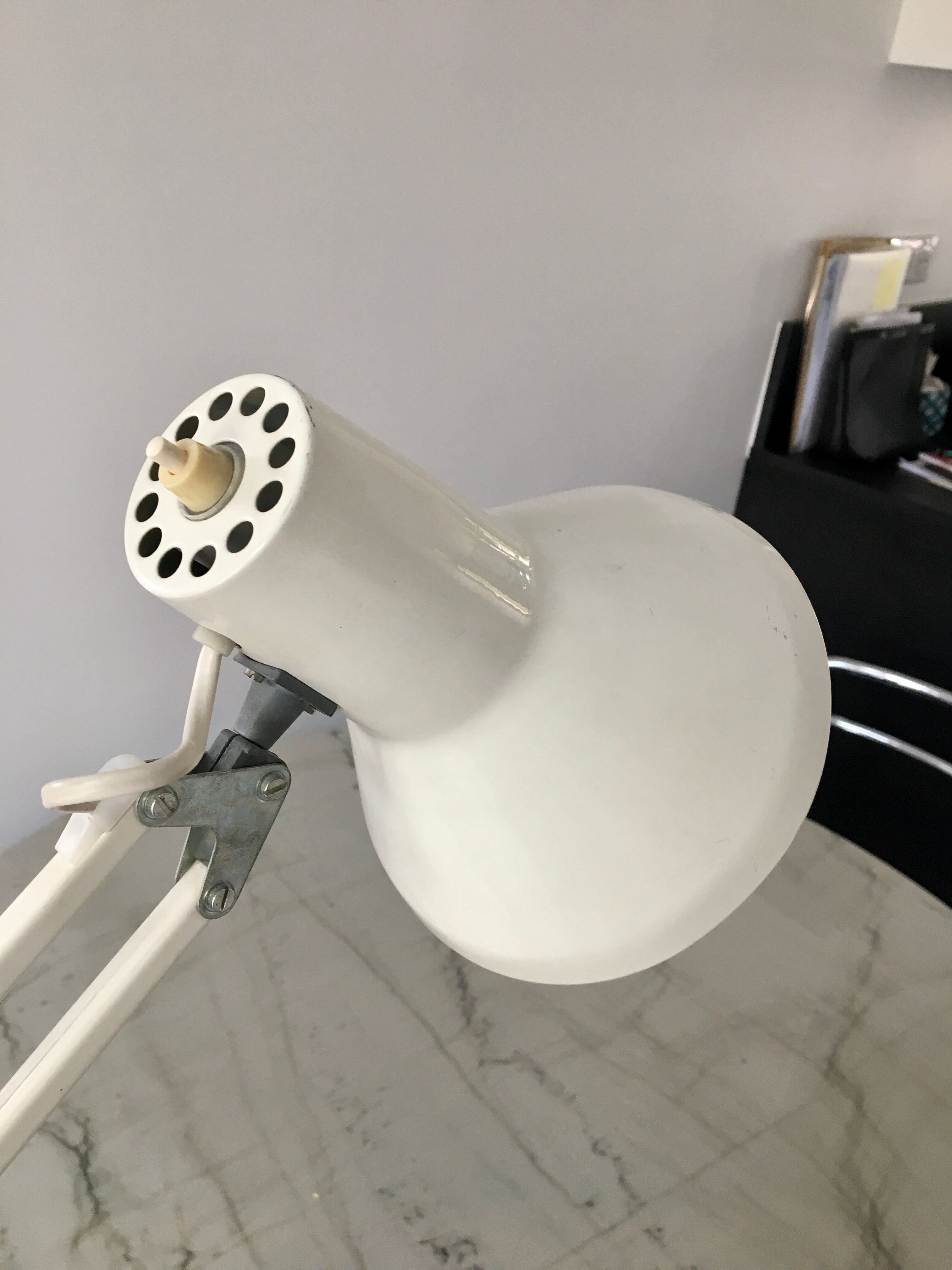 Off-white articulated architect lamp.