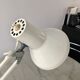 Off-white articulated architect lamp.