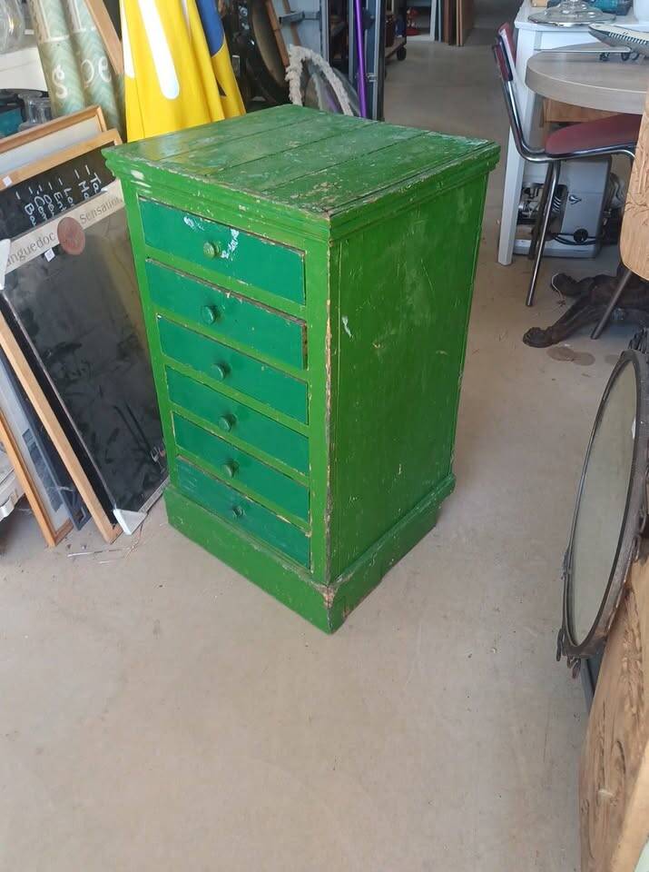 Vintage workshop furniture with 6 green drawers.
