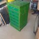 Vintage workshop furniture with 6 green drawers.