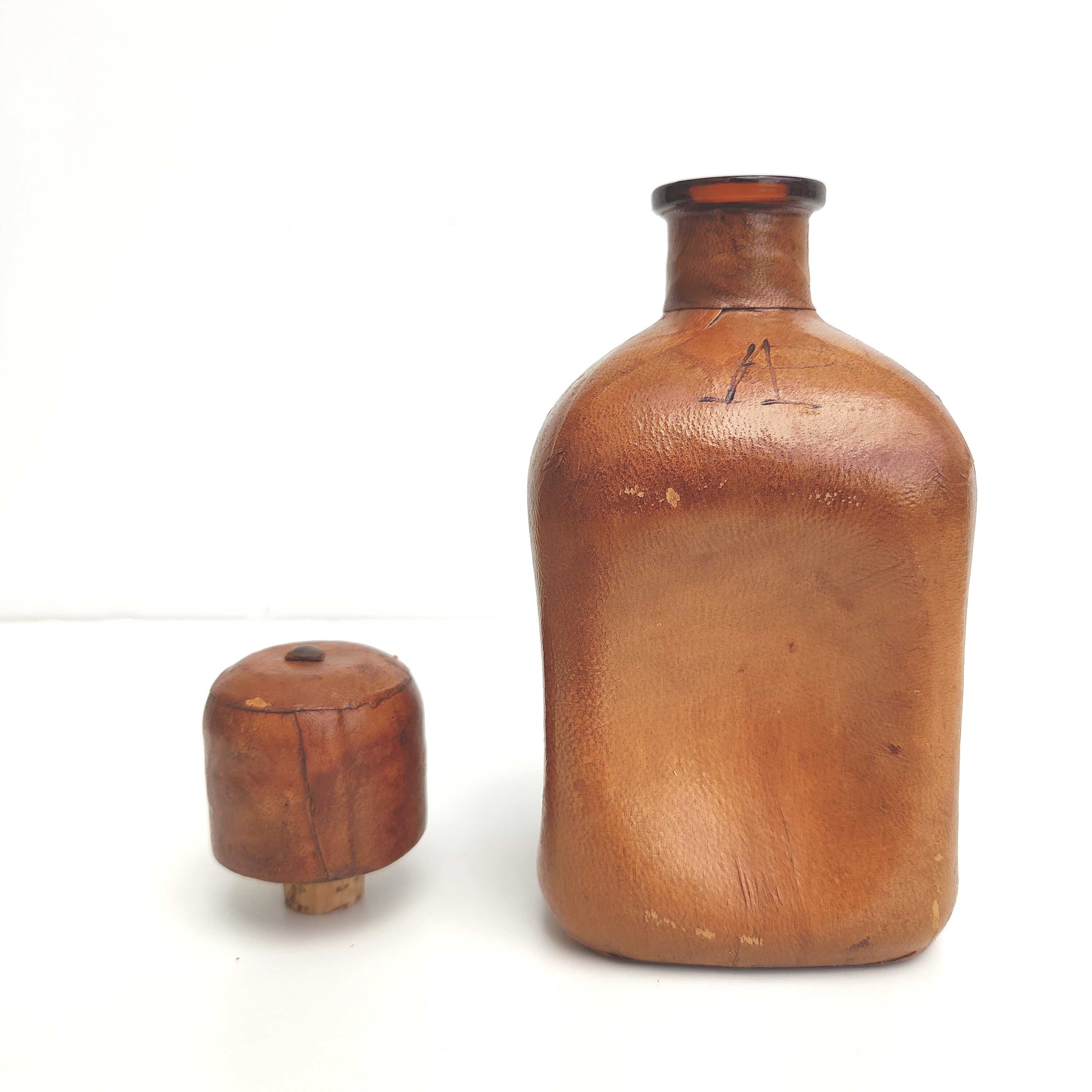 Vintage whisky decanter bottle glass and leather Havana color