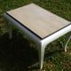 Oak coffee table with curved legs.