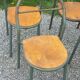 Set of 7 metal chairs by René Herbst with wooden seats.