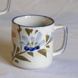 Set of 4 stoneware cups/mugs with blue floral designs, made in China.