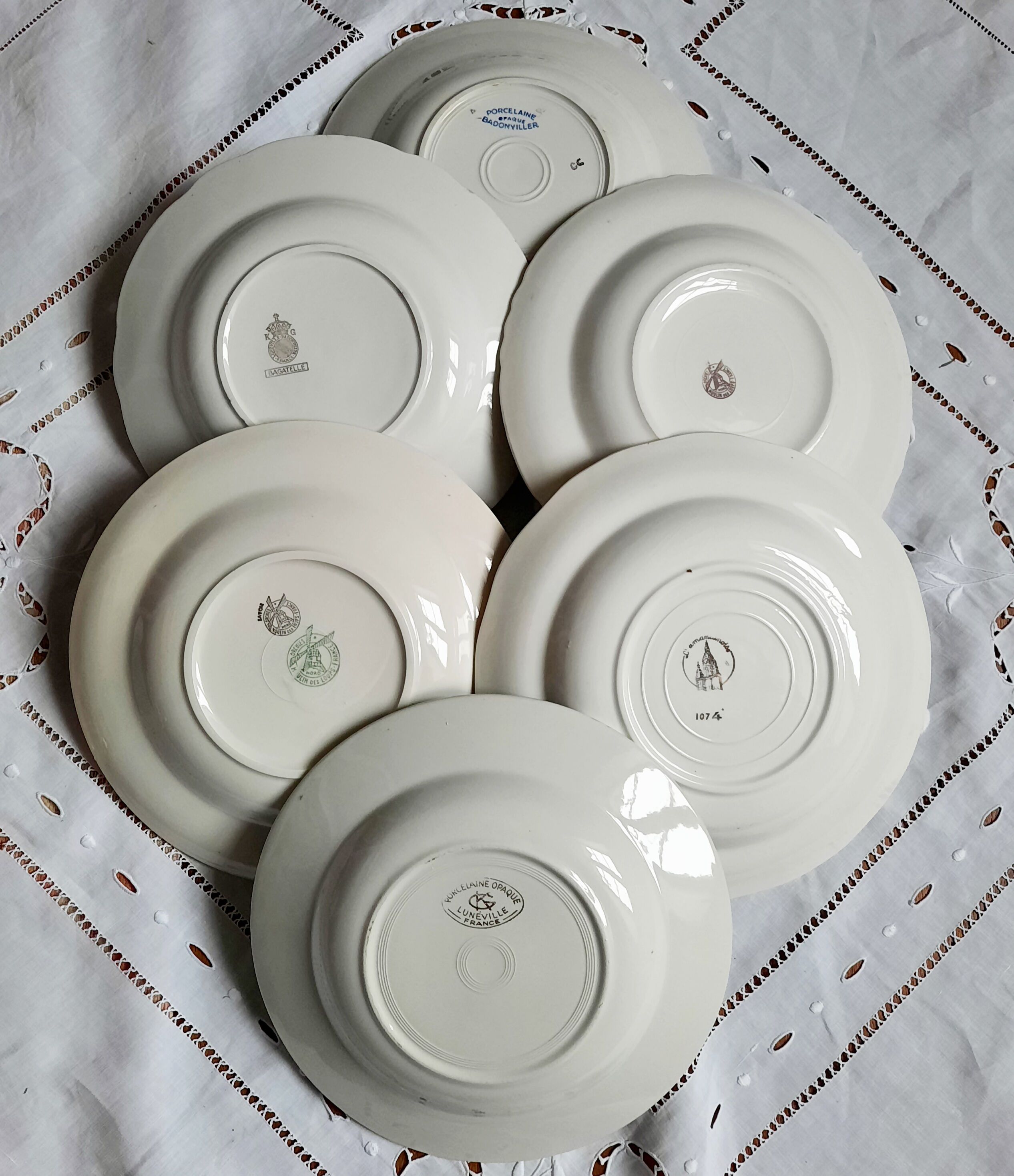 Old hollow plates mismatched in earthenware