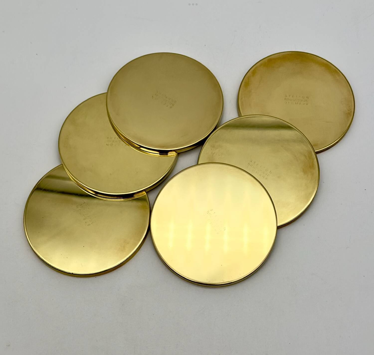 6 Coasters. Stelton. Brass