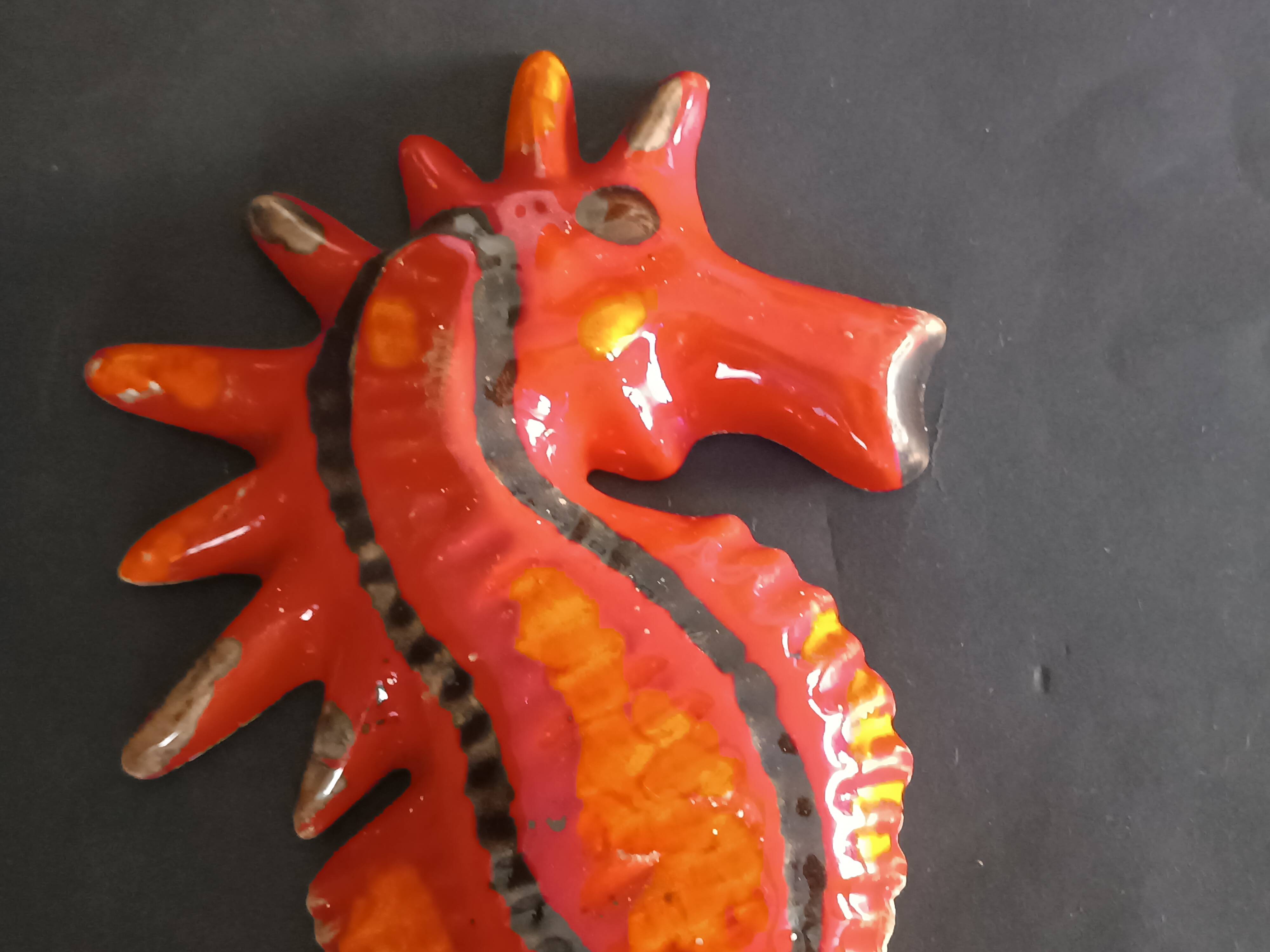 Two vintage ceramic wall pots featuring a seahorse and a starfish.