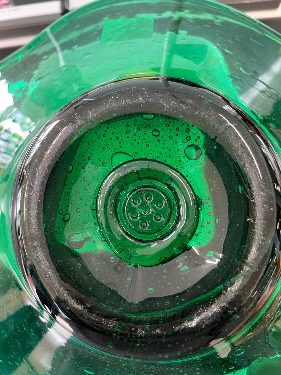 Green glass dish by Max Verboeket