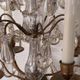Candle holder or candelabrum with four arms of light.