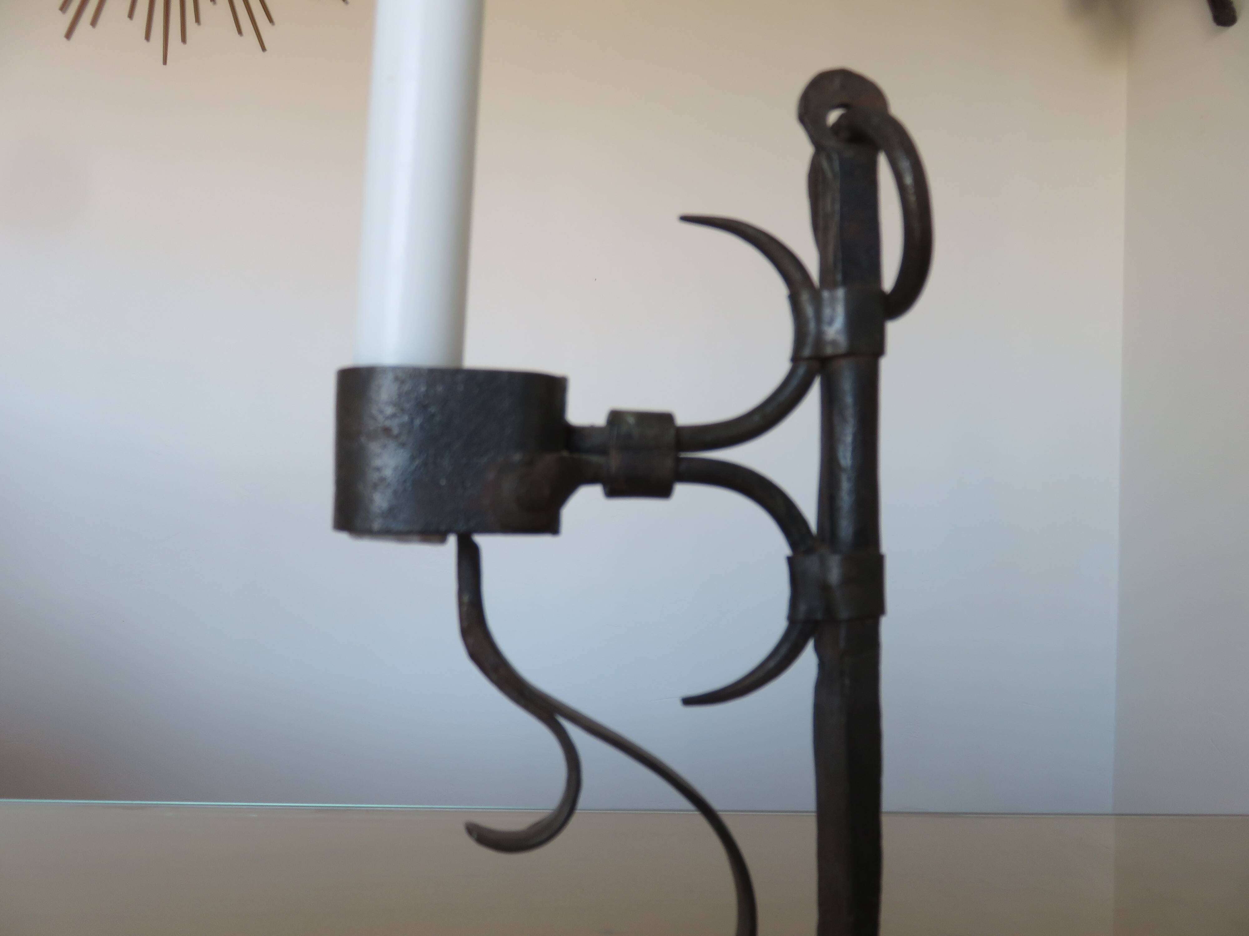 Brutalist candlestick in blackened wrought iron from the 1940s-50s.