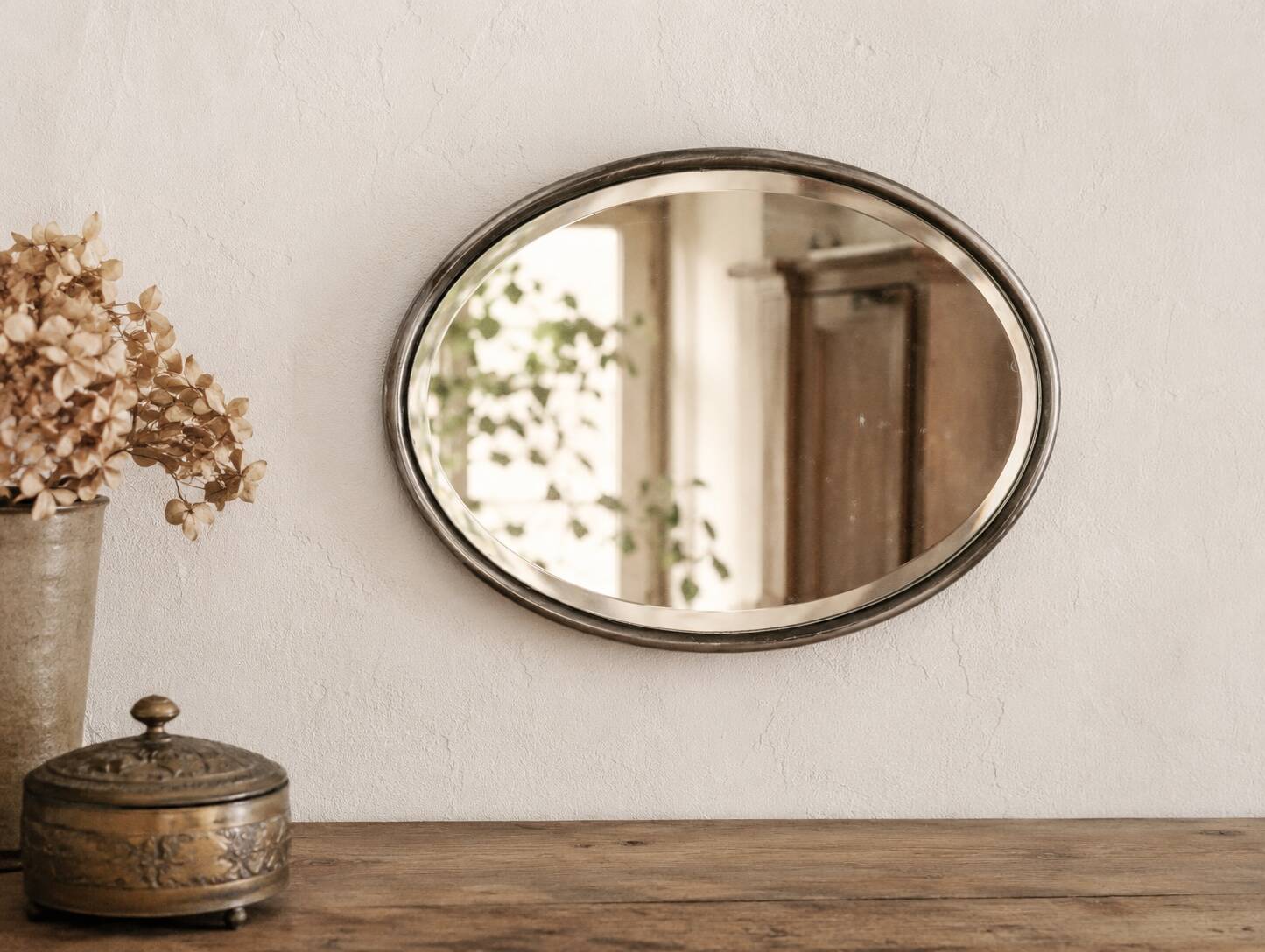 French vintage oval mirror with beveled glass and metal frame