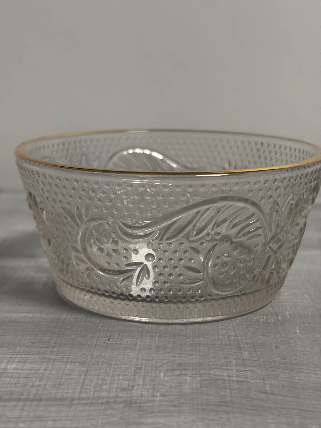 Set of 3 glass bowls with gold embellishments.