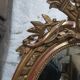 Golden oval mirror
