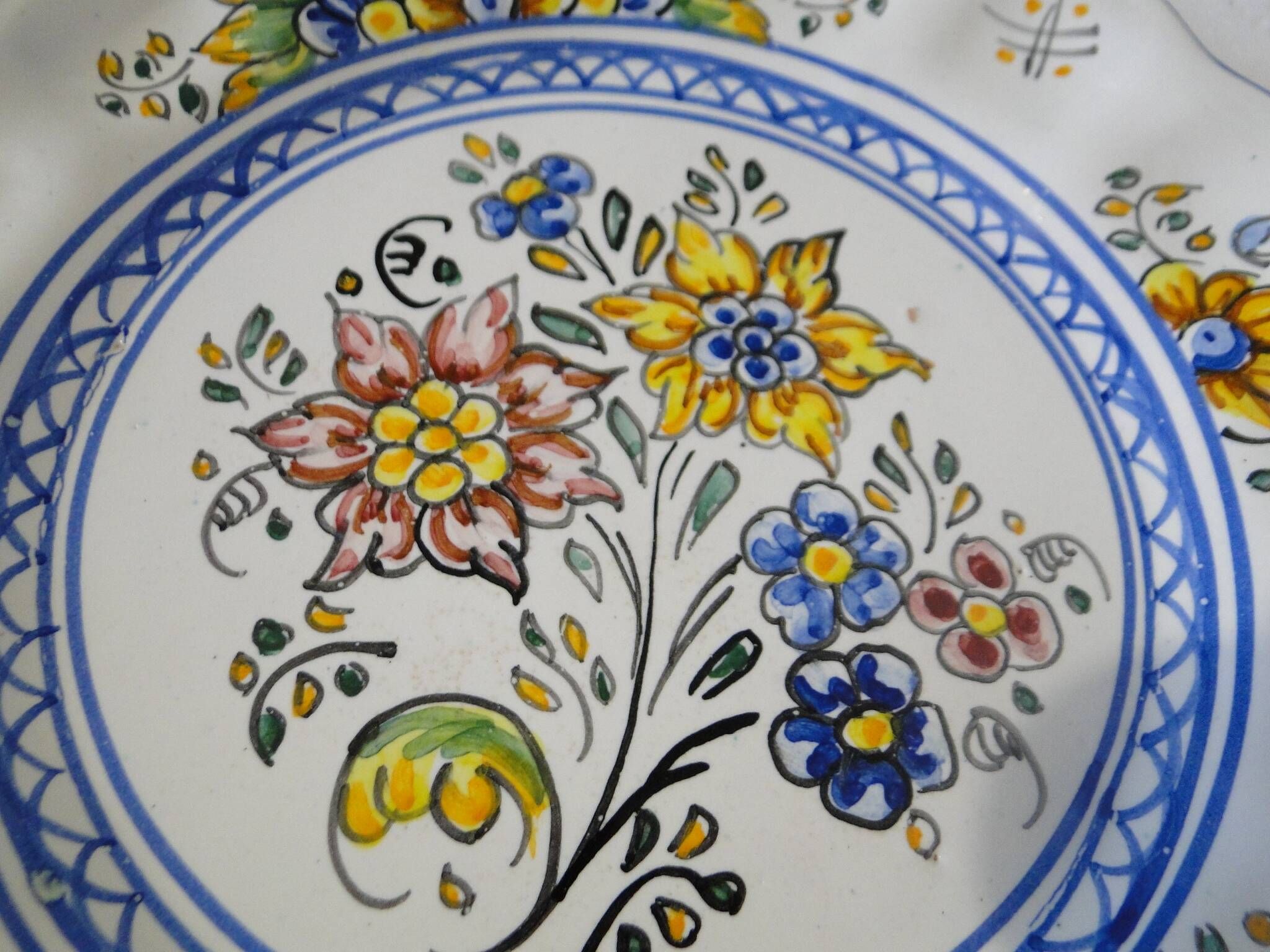 Decorative earthenware plate with floral Talavera decoration