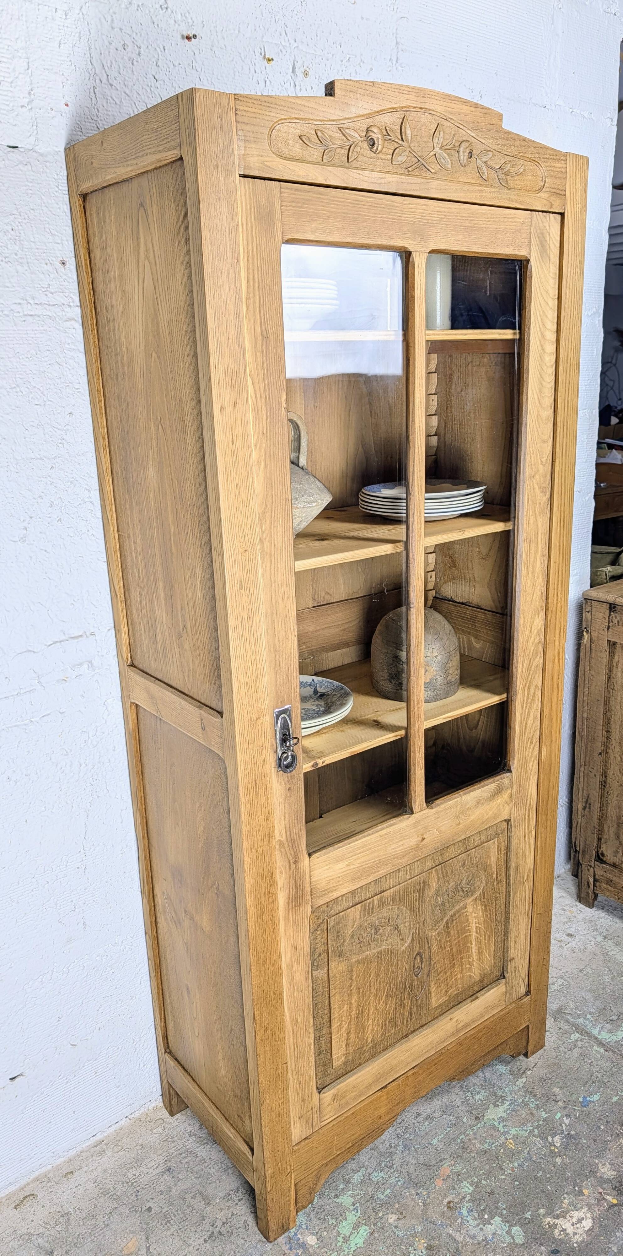 Glass-fronted cabinet from the 1930s-1940s.