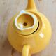 Vintage bright yellow ceramic teapot