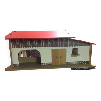 Wooden farm for children with its animals.