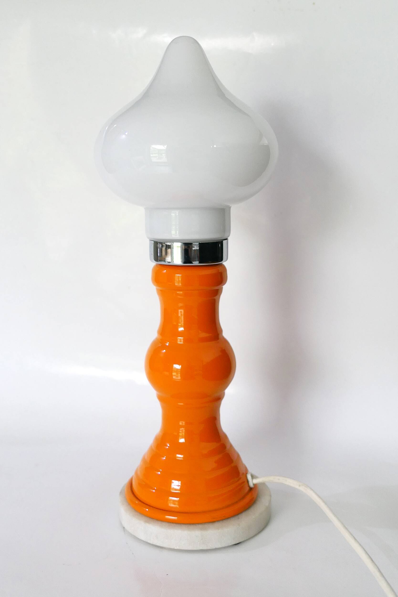 Table lamp or bedside lamp from the 1960s-70s in orange and chrome.