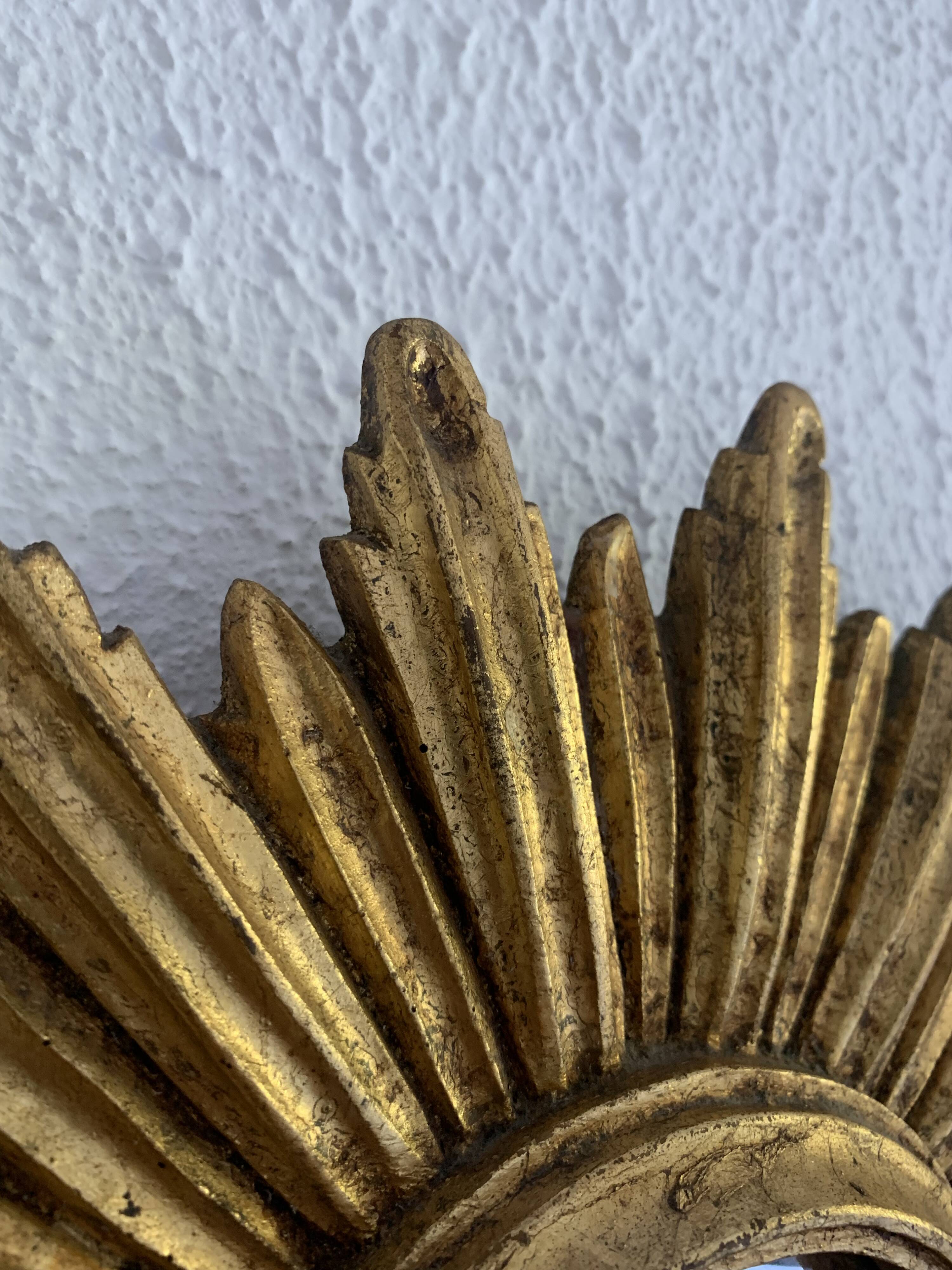 Vintage 1960s sunburst witch's eye mirror in gold - 27 cm