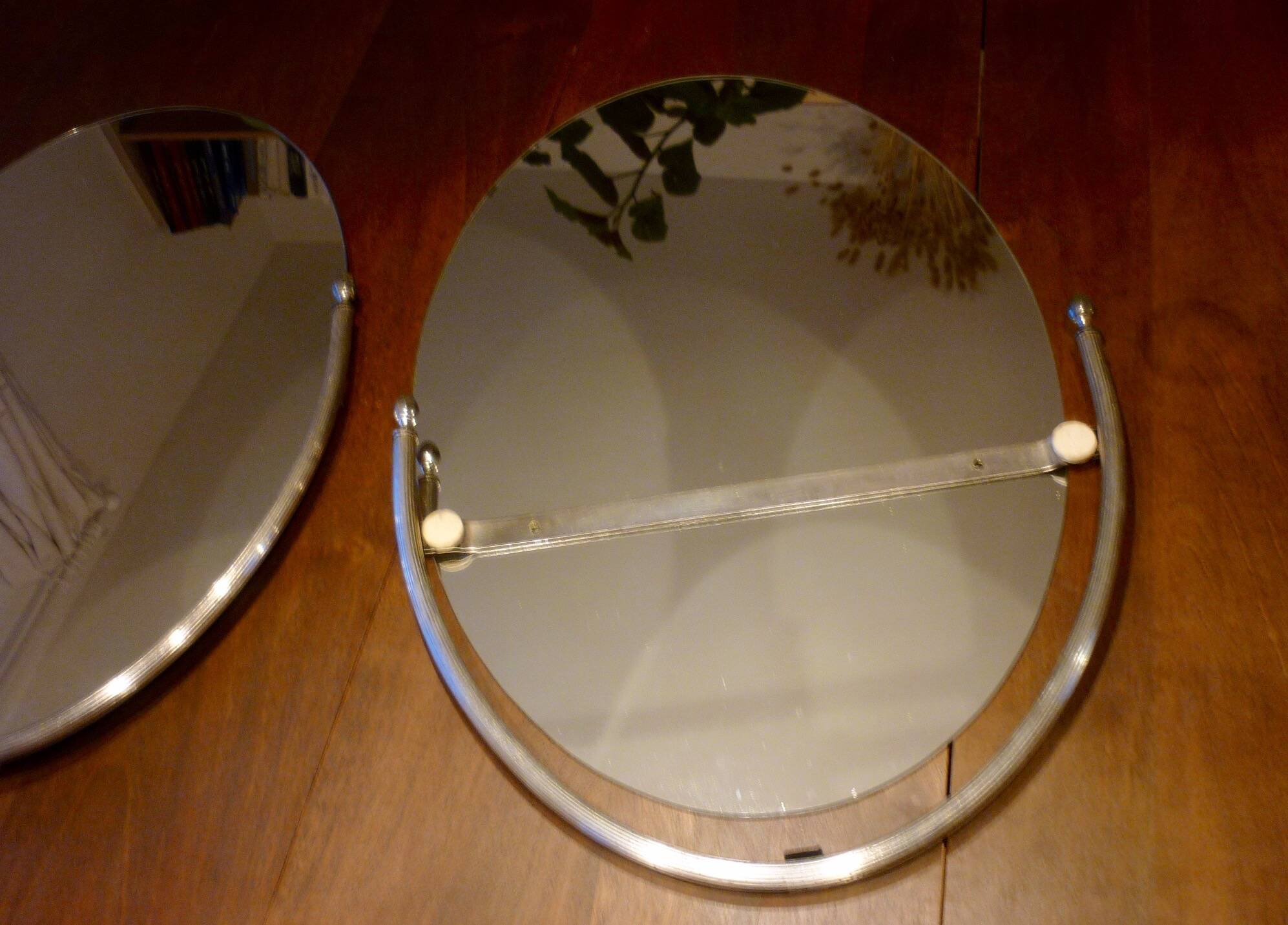 2 bathroom mirrors in silver oval holders