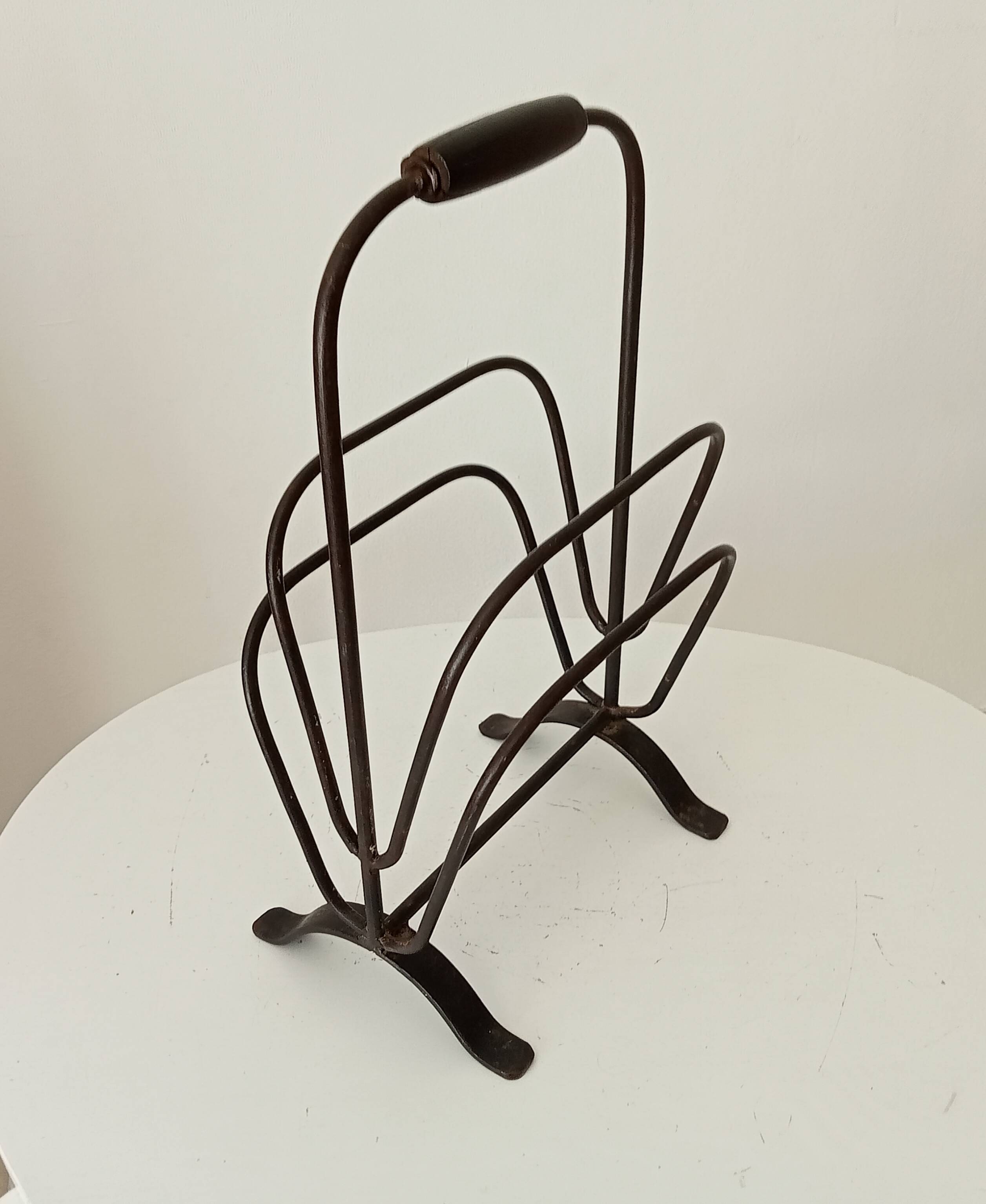 Brutalist wrought iron magazine rack from the 1960s.