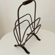 Brutalist wrought iron magazine rack from the 1960s.