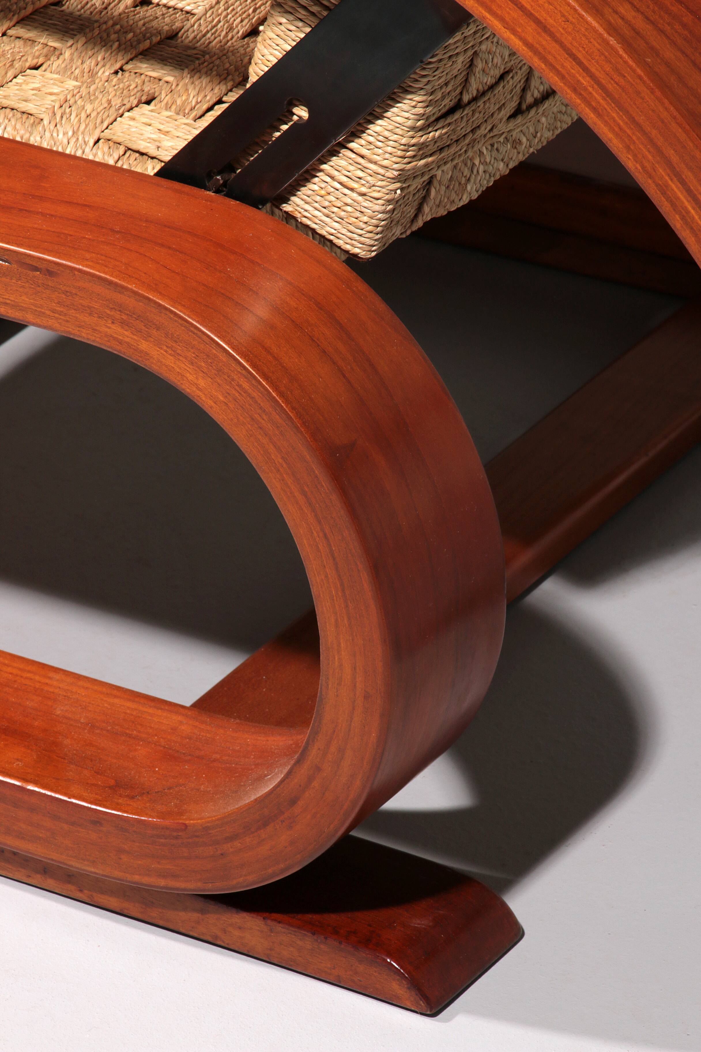 An exceptionally rare mahogany recliner crafted in Italy during the 1950s"