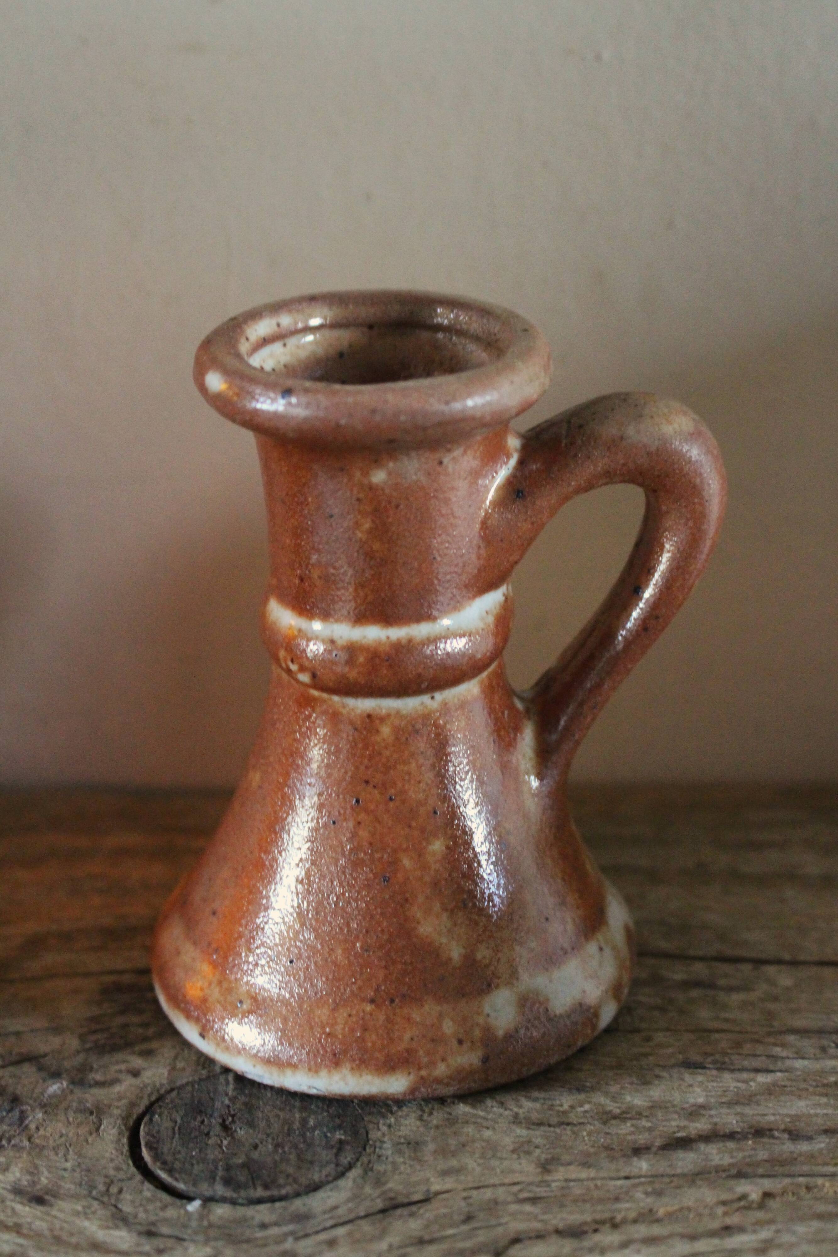 Small vintage marbled stoneware candlestick with handle