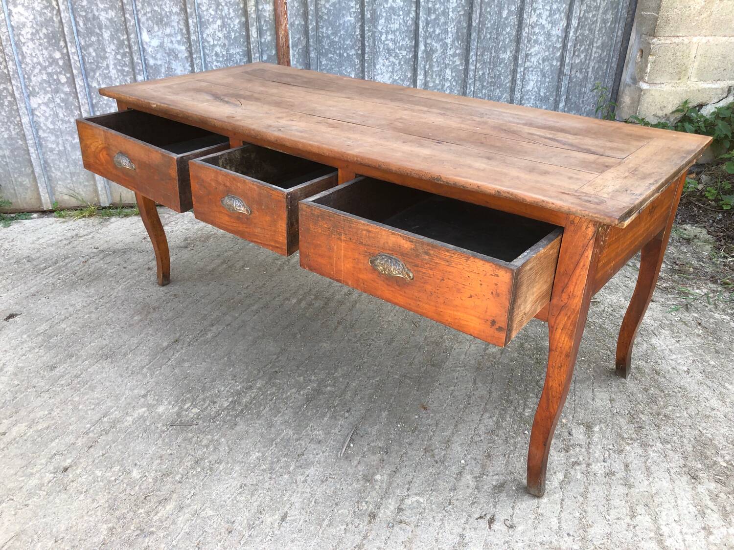 Antique solid cherry farmhouse table with 3 drawers and 2 pulls