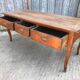 Antique solid cherry farmhouse table with 3 drawers and 2 pulls