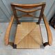 Fauteuil ancien en bois et assise paillée