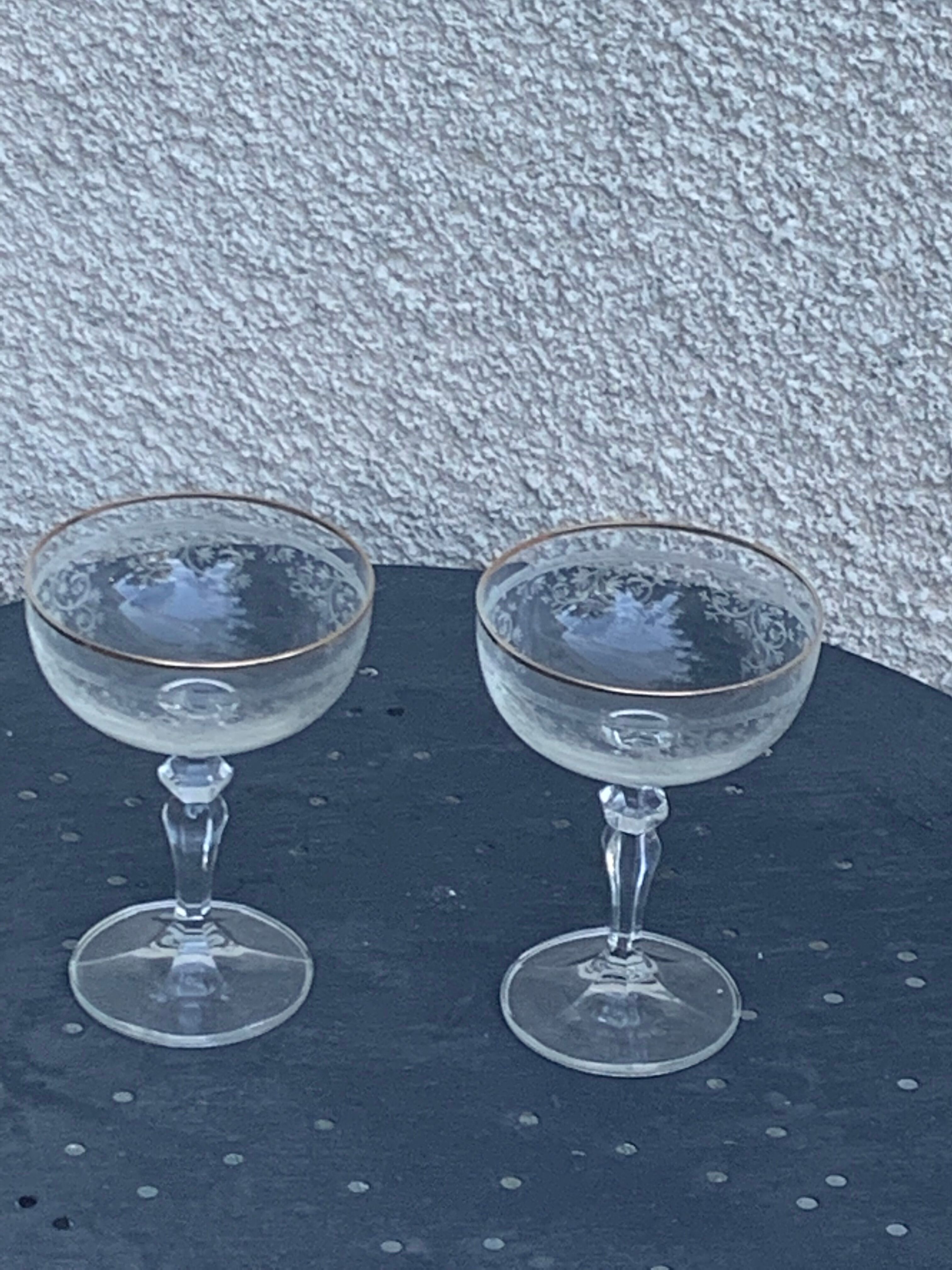 Two crystal champagne glasses and gilded borders antique engraved pattern