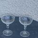 Two crystal champagne glasses and gilded borders antique engraved pattern