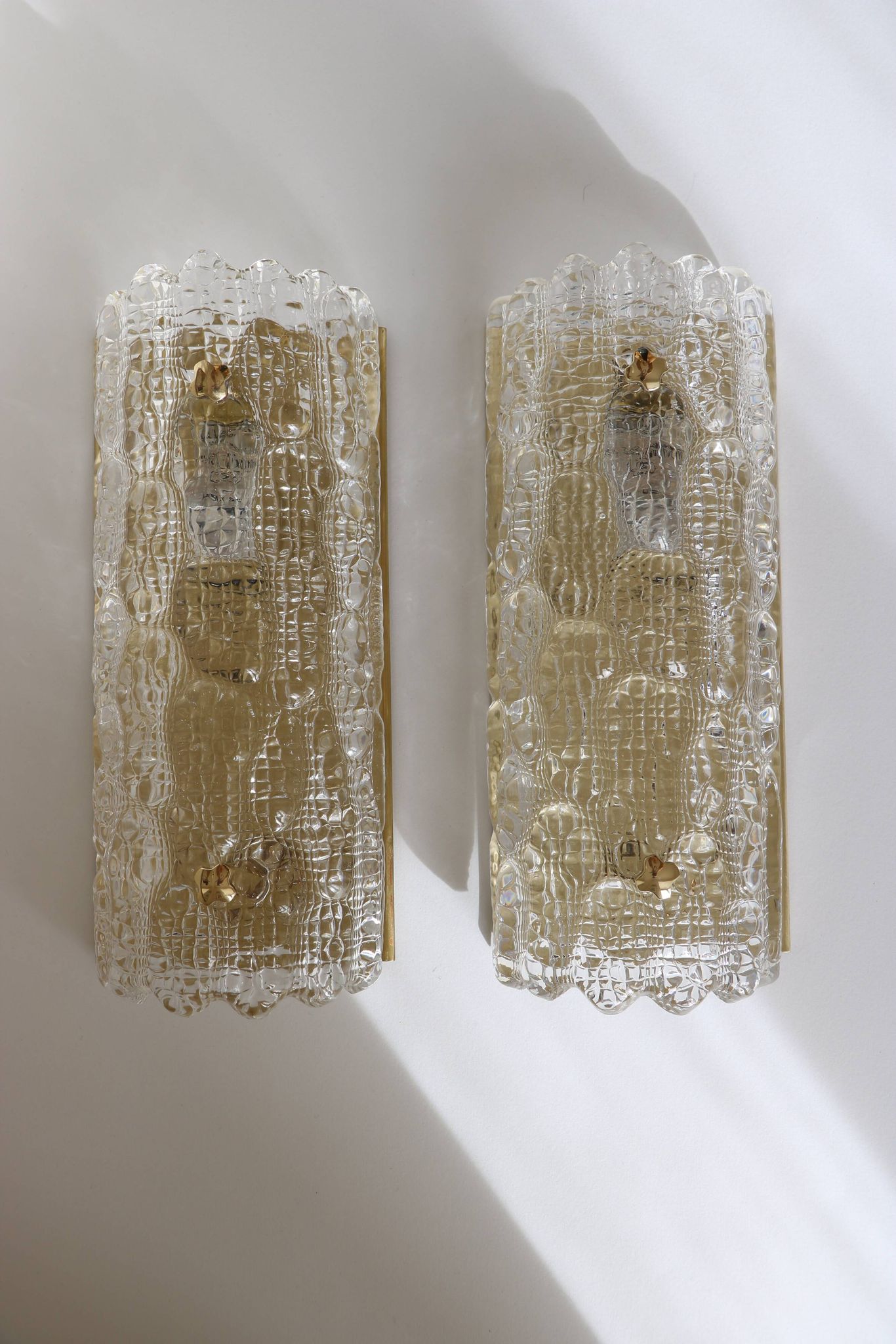 Pair of glass and brass wall lights by Carl Fagerlund for Orrefors, 1960.