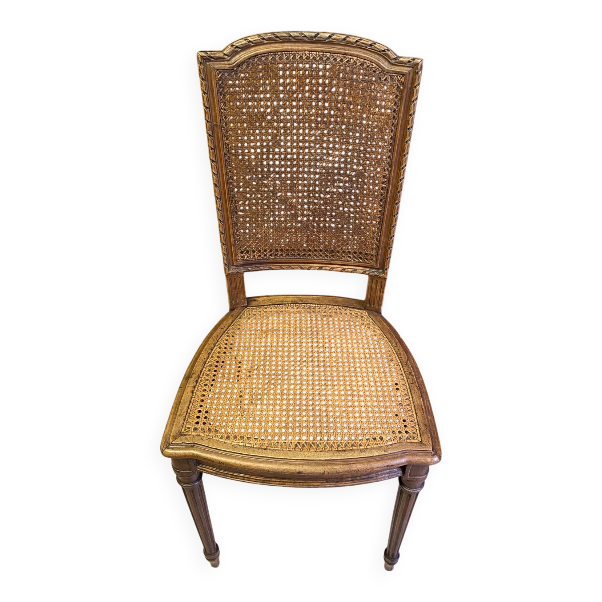 Chair with caned seat and back made of wood