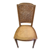 Chair with caned seat and back made of wood