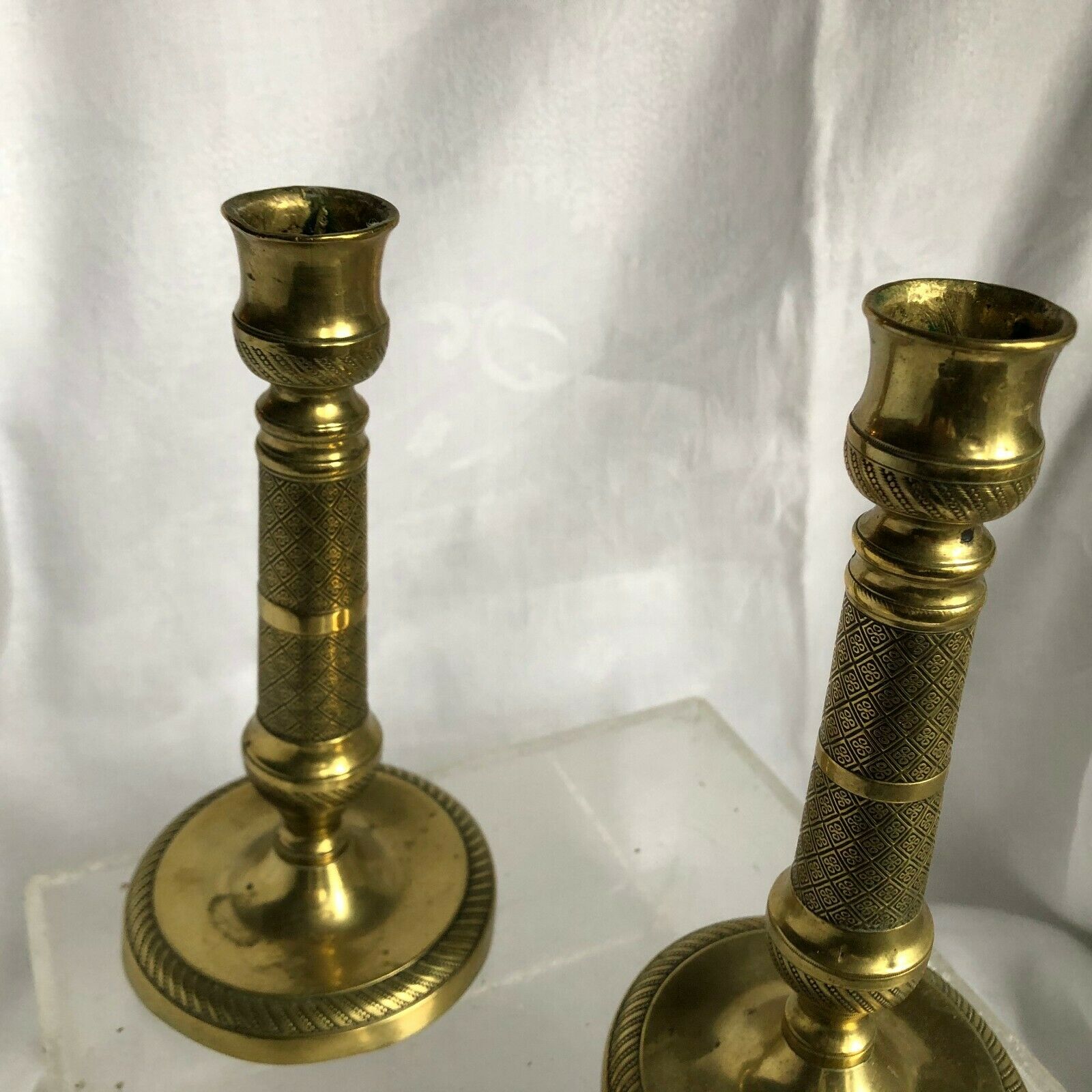 Pair of bronze and brass candlesticks