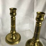Pair of bronze and brass candlesticks