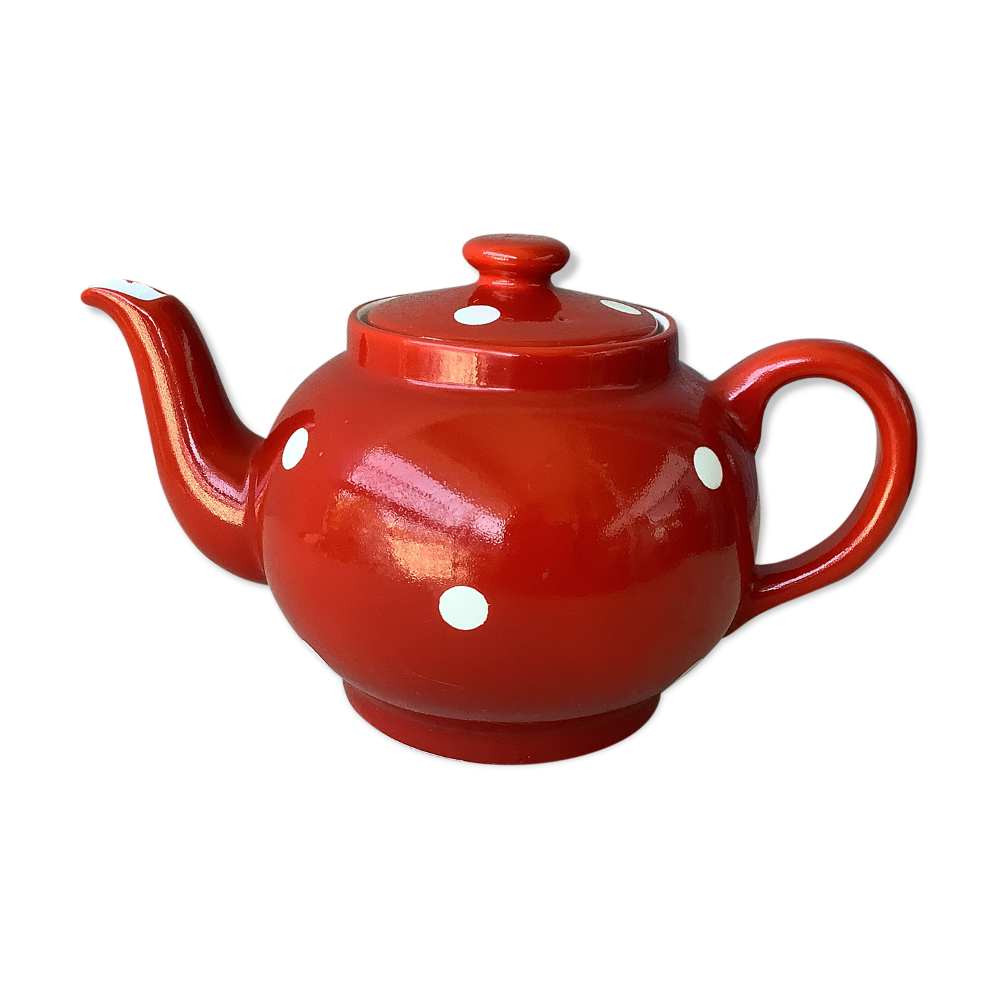 Vintage red teapot with white polka dots