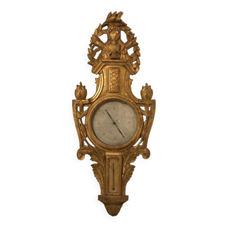 Barometer from the Louis XVI period in gilded wood.